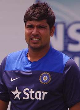 A man in a blue Indian jersey.