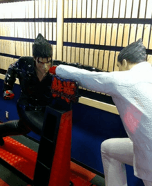 Statue of Jin and Kazuya in a fighting pose