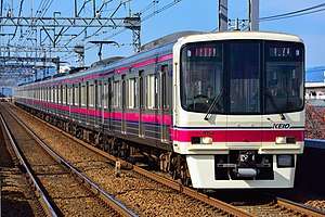 Keio commuter train on railroad track
