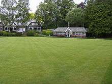 Bowling green with Victorian building at the rear
