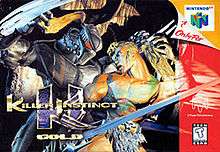 Two stoic characters face each other, interlocking, as if about to engage, behind a gold logo that says "Killer Instinct Gold". A sidebar on the right shows the cube-like Nintendo 64 logo with a 3D peel-off tab that indicates that the game is exclusive to the console. A symbol indicates that the game is suitable for teens to play.