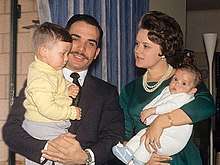 A young King Hussein and Princess Muna, holding their two young sons