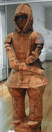 Terracotta figure of a man in armour.