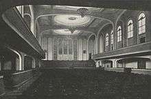 black-and-white photograph of the interior of a large empty concert hall