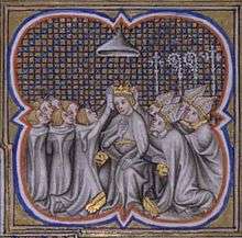 Four bishops and five young men kneeling before a man who sits on a throne