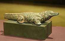 Bronze statue of a crocodile inlaid with gold