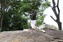The Murugan Statue in Kumbakarai Falls
