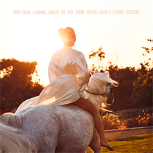 An image of Lady Gaga riding a horse, against the setting sun.