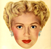 Woman with updo staring into camera