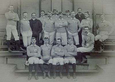 A body or rugby union players posing in uniform before a match