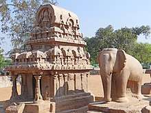 Temple exterior, with a carved elephant next to it