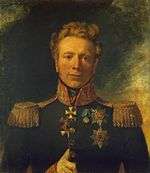 Painting shows a wavy-haired man with a cleft chin with his thumb thrust between the buttons of his coat. He wears a dark green military uniform with a high collar, epaulettes and several awards on his breast.