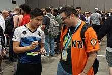NuckleDu signing a video game for a fan