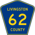 A blue pentagon with a yellow border and three lines of yellow text, reading Livingston County 62.