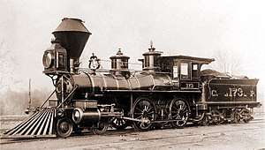 A black-and-white image of an old steam locomotive and tender bearing a resemblance to the DRR's No. 1 locomotive and tender