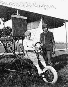 Longren and his wife Dolly standing in front of a Longren airplane