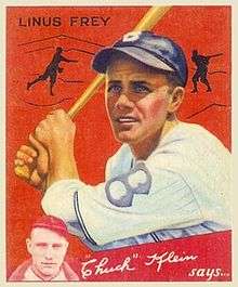 A baseball card showing a man wearing a white baseball uniform with a blue "B" on the chest and a blue cap holds a bat above his right shoulder.