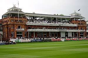 A large building with several balconies in which spectators are seated