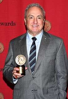 Lorne Michaels holding a Peabody Award at the 2013 Peabody Award Ceremony