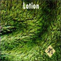 A field of thick greenery with the word "Lotion" written in white at the top and a small yellow diamond with a black outline of a monkey in the bottom right corner