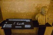 A stone bust of Braille with an audiotronic memorial plaque