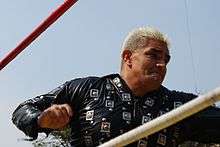 Wrestler Shocker, still wearing his ring jacket during an outdoor wrestling event.