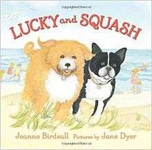 The words "LUCKY and SQUASH" in red forming a semicircle above two dogs, the one on the left a shaggy butterscotch-and-white and the one on the right a short-haired black-and-white