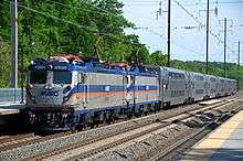 Silver locomotives with blue and orange striping