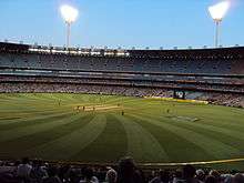 View of the Melbourne Cricket Ground under lights