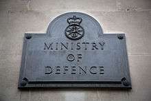 The Ministry of Defence plaque outside the south door of Main Building.