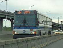 The combined bus and high-occupancy-vehicle lane on the Long Island Expressway, near the interchange with the Brooklyn–Queens Expressway