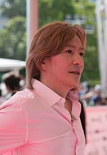 A 2014 photograph of Tetsuya Komuro