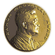 Medallion with an embossed image of Ramon Magsaysayl facing right in profile.