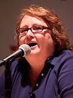 Maile Flanagan speaking into a microphone