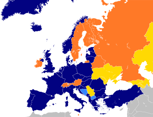 A map of Europe with countries in blue, cyan, orange, and yellow based on their NATO affiliation.