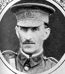 A portrait of a soldier in a peaked cap