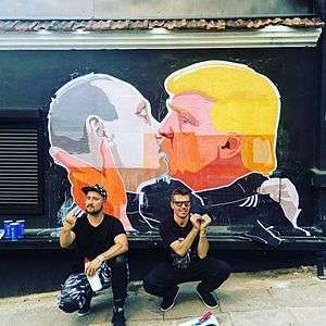 Street art mural ″Make Everything Great Again″ depicting US Republican presidential candidate Donald Trump giving a French kiss to Russian president Vladimir Putin