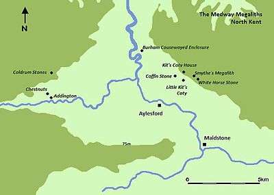 A map featuring a river moving from the top of the image (north) to the bottom right corner (southeast). Various black dots mark out the location of Medway Megaliths on either side of the river.