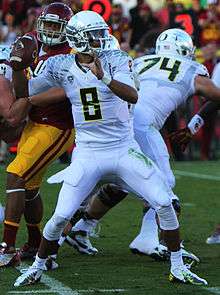 Marcus Mariota playing for the Oregon Ducks football team in 2013