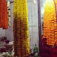hanging garlands made of Marigold offered to the central deity