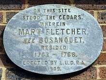 Plaque reads: "On this site stood "The Cedars," wherein Mary Fletcher, née Bosanquet, resided 1763 – 1768. Erected by L.U.D.R.A. 1909."