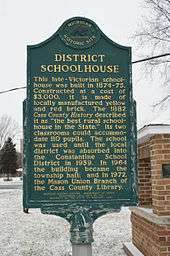The Michigan Historical Marker that is placed on the grounds of the Mason School House.