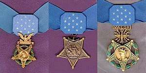 Three medals, side by side, consisting of an inverted 5-pointed star hanging from a light blue ribbon with 13 white stars in the center. Left medal has a laurel wreath around the star and an eagle emblem above the star; central medal has an anchor emblem attaching the medal to the ribbon; rightmost medal has a laurel wreath around the star and an emblem with wings, lightning bolts and the word "VALOR" connecting the medal to the ribbon.
