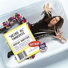 The cover to Medium Rarities, depicting "Weird Al" Yankovic shrink-wrapped in meat packaging