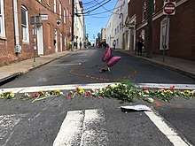 Floral tributes on an empty street