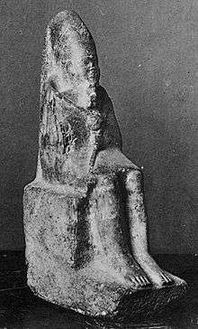 Statuette of a seated king holding a mace and wearing the long crown of Upper Egypt