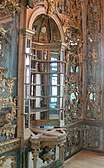 Mirrored wall covering with golden ornamentation