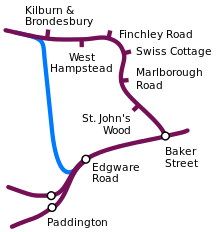 A line is shown at the bottom, from right to left, with stations at Baker Street, Edgware Road and junction before two Paddington stations. From Baker Street a line is shown going north through several stations before turning left. From Edgware Road a line in a contrasting colour is shown, going north bypassing these stations before joining the line from Baker Street just north of Kilburn & Brondesbury.