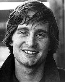 A black and white photograph of Michael Douglas in 1969