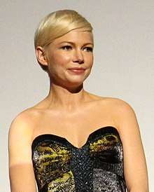 Michelle Williams looks away from the camera.